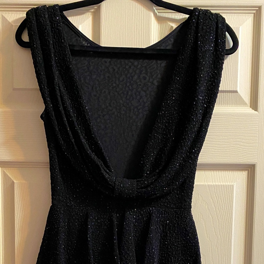 Sparkly black dress with scoop back and peplum